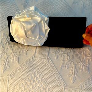 STEVE MADDEN BLACK SATIN CLUTCH BAG WITH WHITE SATIN FLOWER DECORATION